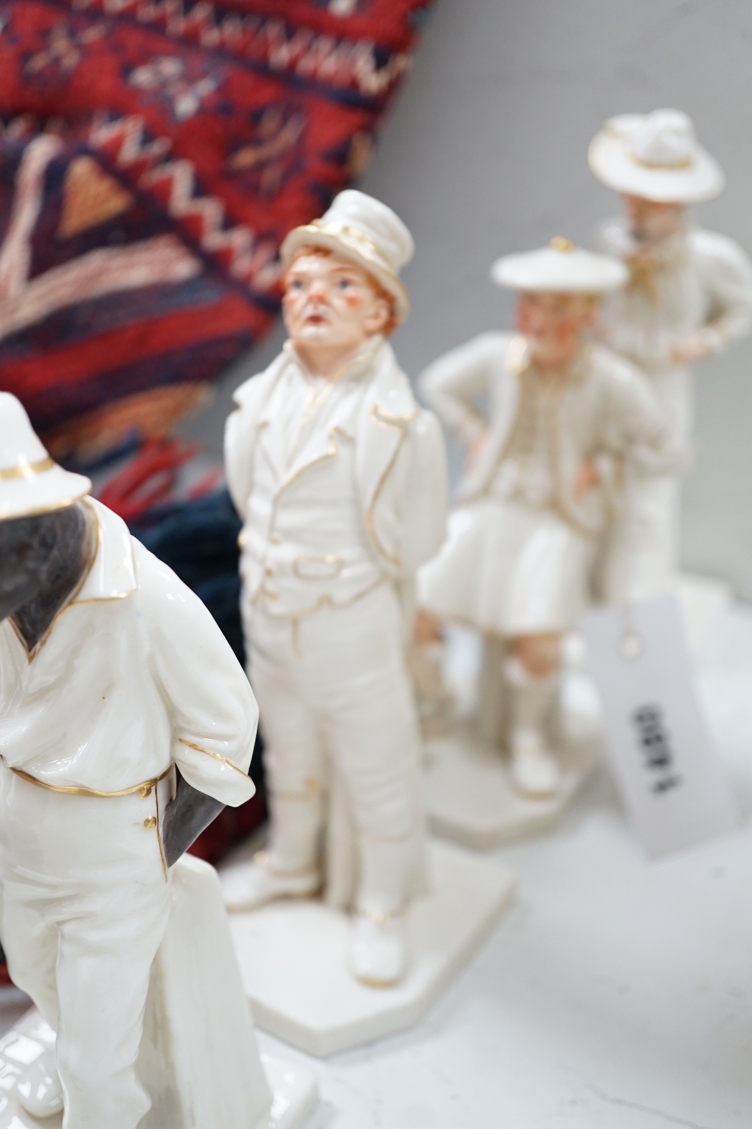 Seven Royal Worcester Hadleys figures of the World, tallest 17.5 cm